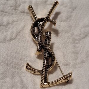 YSL GOLD AND BLACK BEAUTIFUL BROOCH Saint Laurent